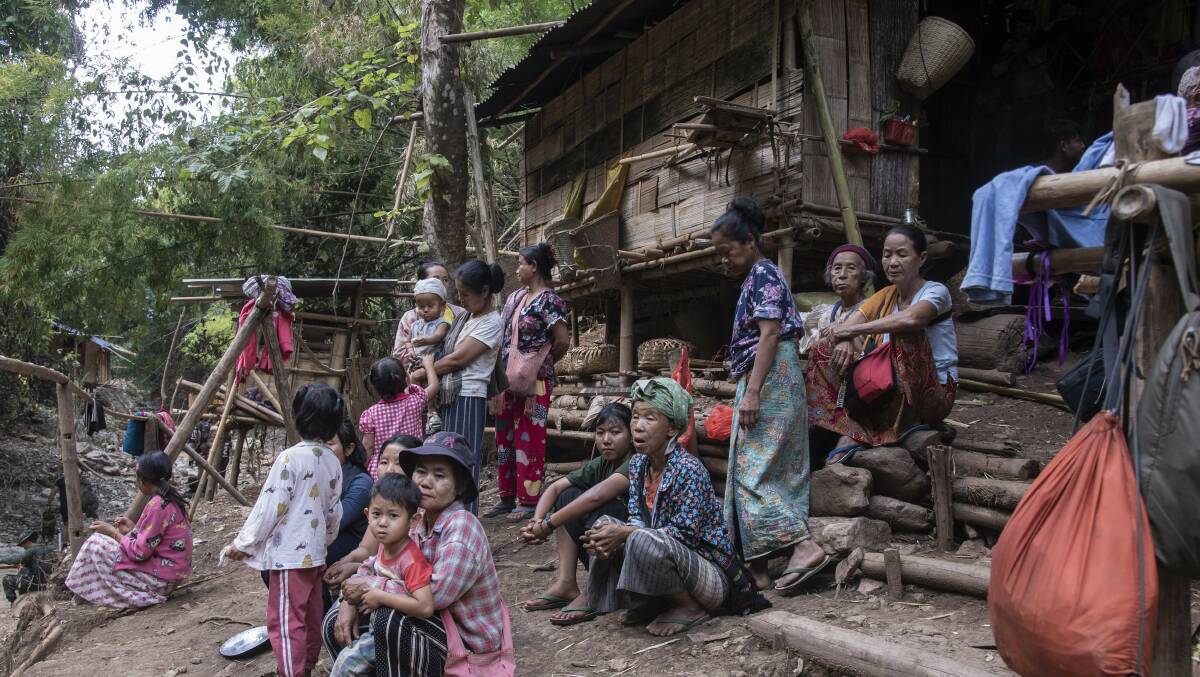 People sit in front of a makeshift house in an Internally Displaced People settlement in Myanmar earlier this year. Picture Getty Images