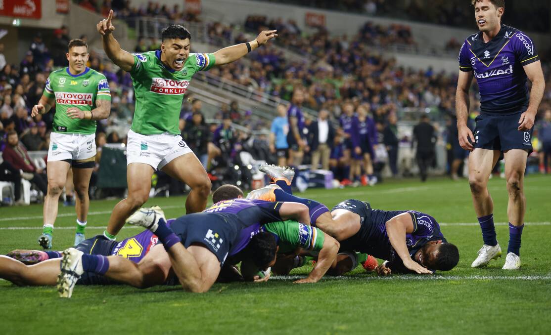 Jamal Fogarty (above) busted through some flimsy defence to score, while (left) Joe Tapine was again incredible in the engine room for Canberra. Pictures by Getty Images