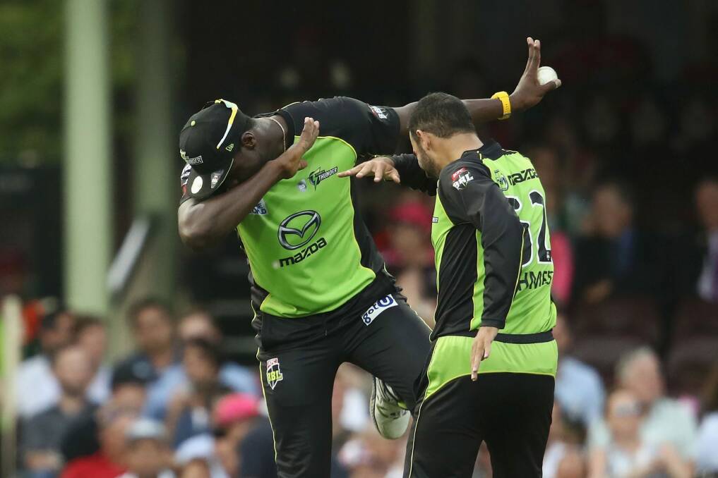 Running the show: Carlos Brathwaite and Fawad Ahmed. Photo: Getty Images