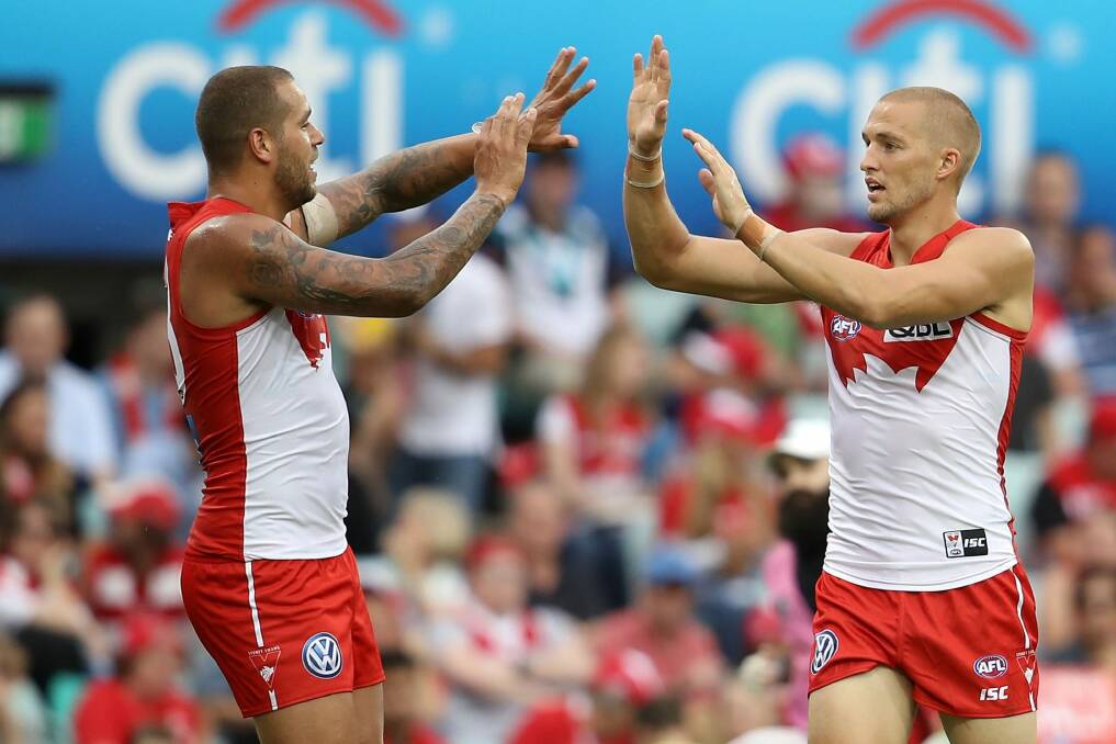 Century up: Sam Reid (right) will play his 100th AFL game on Friday night. Photo: Getty