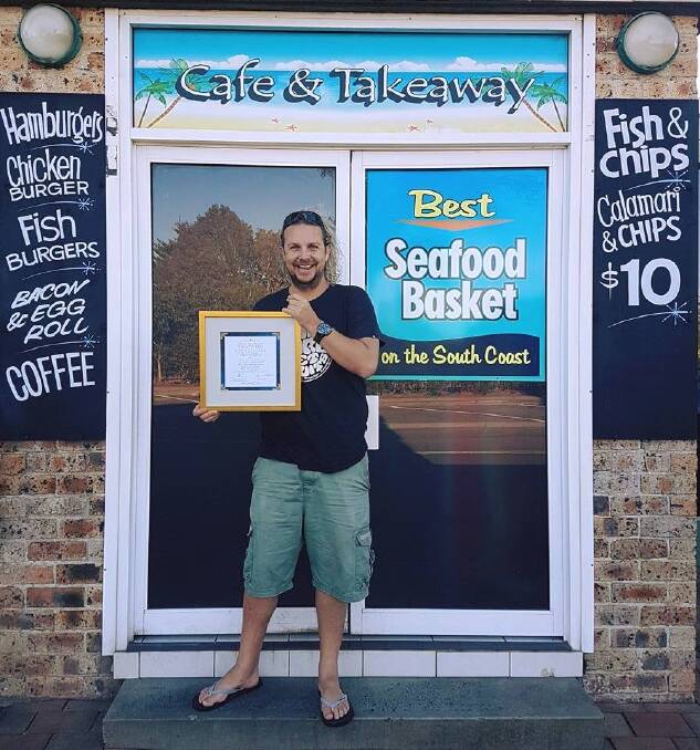 Sam Cardow, owner of The Pelican Rocks Cafe at Greenwell Point, with his award for the best fish and chips in NSW. Photo: Facebook