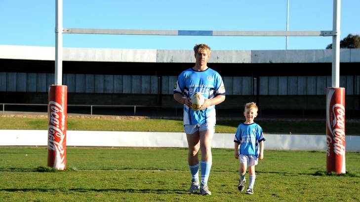 Queanbeyan Blues player Jay Lasscock with his son Cooper. Jay Lasscock died suddenly on Sunday. Photo: Elesa Lee