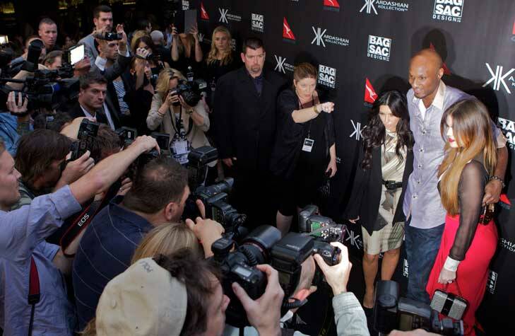 Kim and Khloe Kardashian with Khloe's husband LA Lakers basketballer Lamar Odom shortly after arriving in Australia in early November.