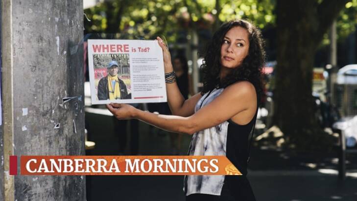 Tad Kahsai's daughter Rezina with missing posters for her father in January.  Photo: Rohan Thomson