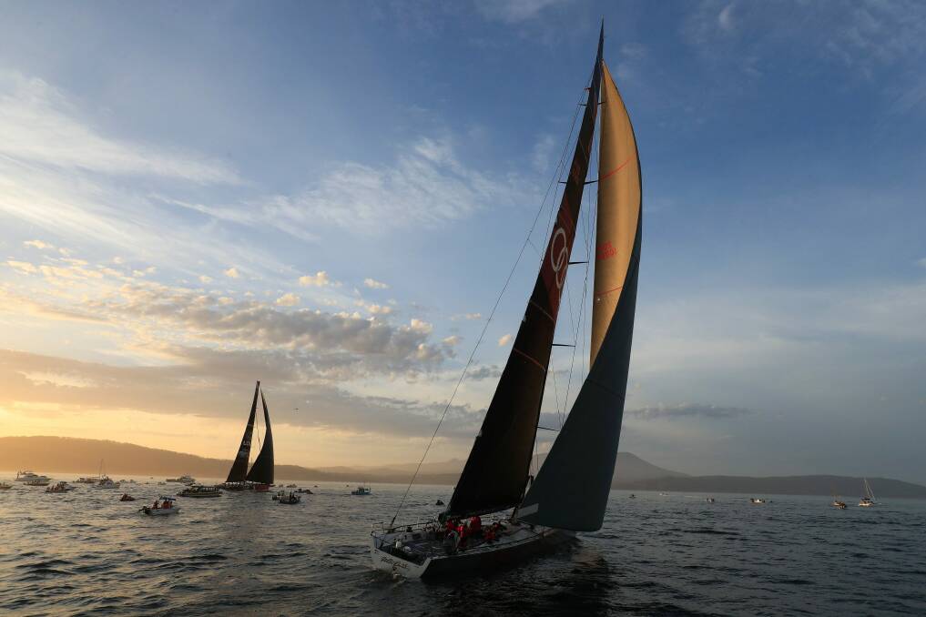 Runner-up Comanche, left, and Sydney to Hobart winner Wild Oats, right, on the River Derwent at the finish on Wednesday night. Photo: AAP