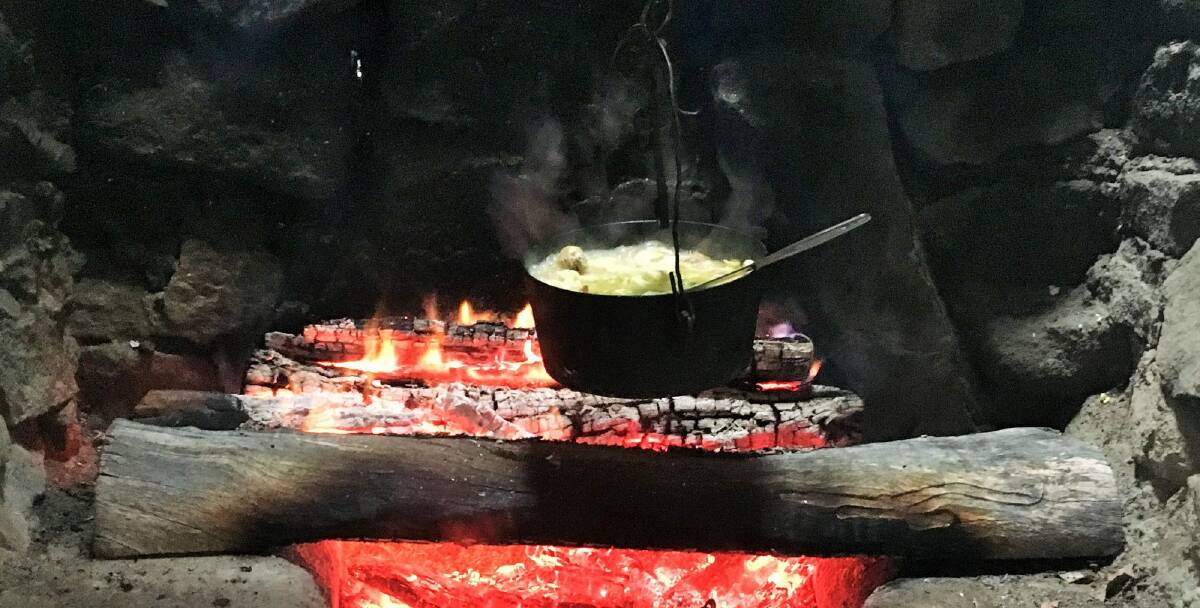 Hearty chicken soup cooking in the camp oven at Ted’s Hut. Photo: Tim the Yowie Man