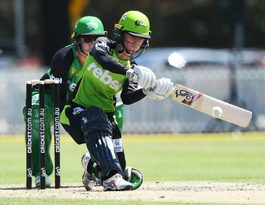 Over the top: Rachael Haynes of the Thunder plays for a boundary against the Melbourne Stars at Penrith's Howell Oval. Photo: AAP
