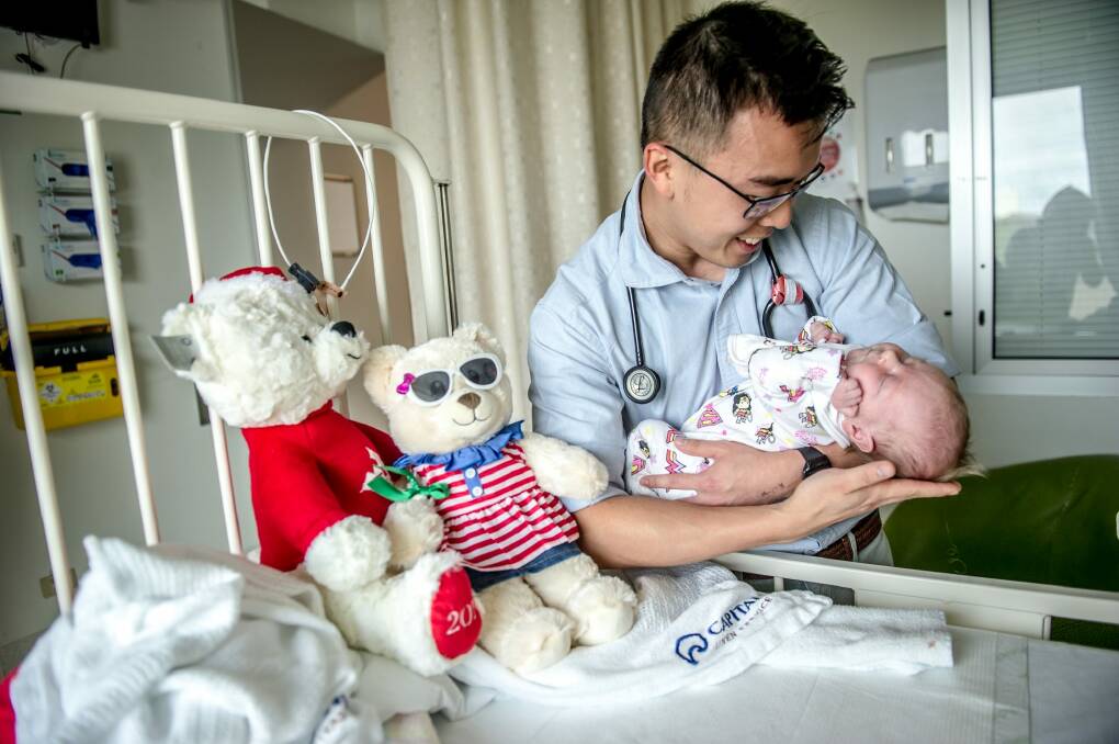 Dr Choon Lim Wong gives one-month-old Jean Hallam her teddy and a cuddle. Photo: karleen minney