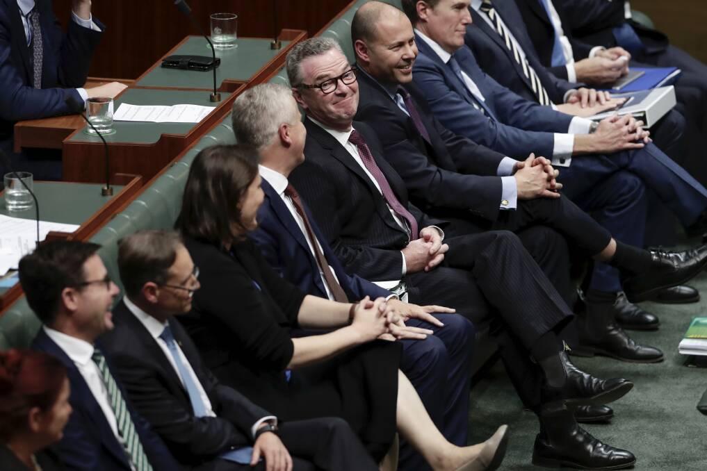 Christopher Pyne takes his seat after delivering his valedictory speech. Photo: Alex Ellinghausen