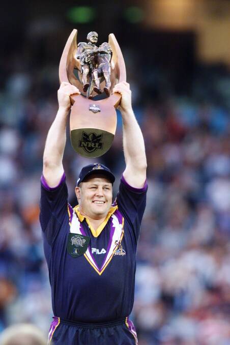 Melbourne Storm captain Glenn Lazarus with the NRL trophy in 1999. Photo: Andy Zakeli