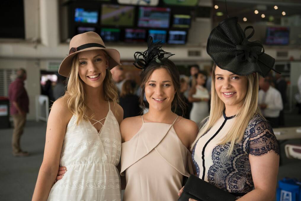 Jessica Zovak of Macgregor, Emily Wilson of Dunlop and Allie Lucas of Dunlop enjoying all the action at Melbourne Cup day at Thoroughbred Park  last year. Photo: Jay Cronan