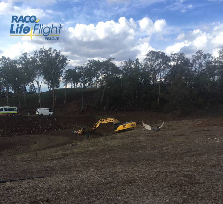 The man was trying to remove the bobcat that was bogged when the bucket of an excavator he was standing next to crushed him. Photo: RACQ LifeFlight Rescue