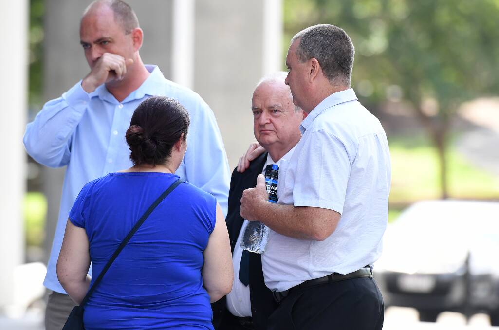 Mark Knowles (right), brother of murder victim Patricia Riggs, and her father, Jon Knowles (second right) with other family members outside the Supreme Court in Brisbane on Thursday.  Photo: AAP