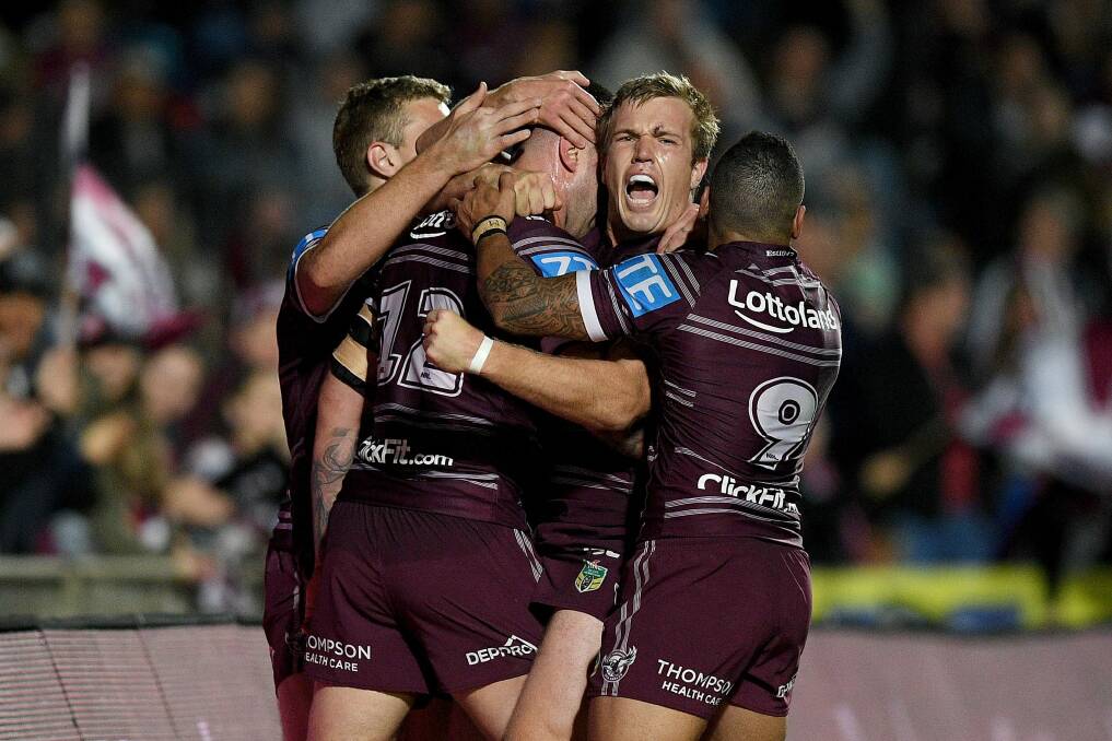 Fired up: Curtis Sironen celebrates with teammates after adding another four-pointer. Photo: AAP