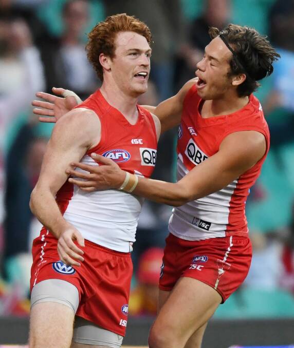 Feeling taller: Gary Rohan (left) says he is a better player when Lance Franklin is on the field. Photo: AAP