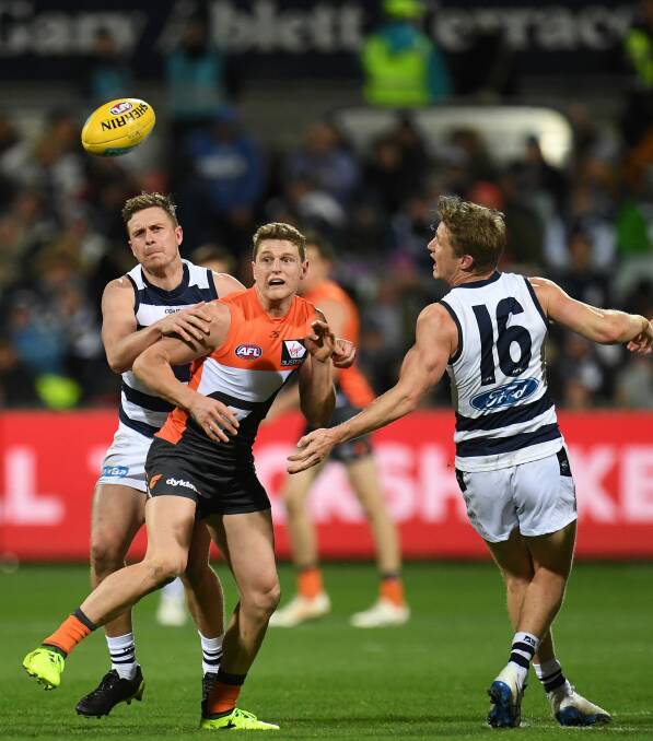 Rising star: Jacob Hopper contests possession against the Cats. Photo: AAP