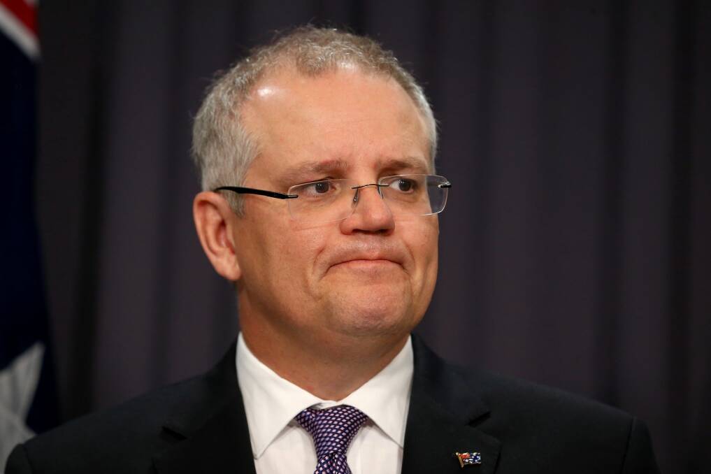 Treasurer Scott Morrison says Australia must confront the "air of unreality" about its budget challenge. Photo: Alex Ellinghausen