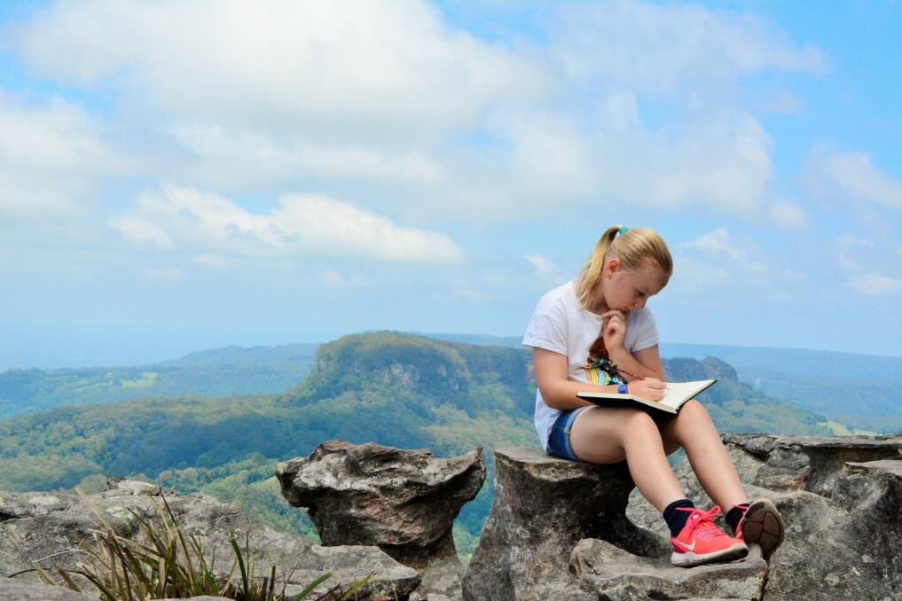 Sarah sketches atop Drawing Room Rocks. Photo: Tim the Yowie Man