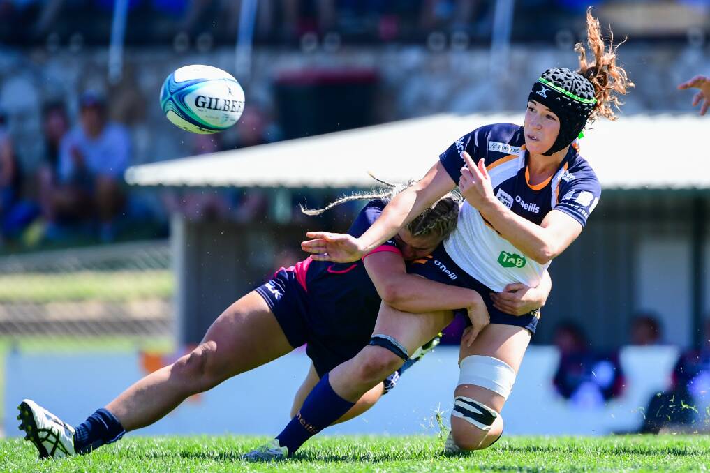 Georgia O'Neill gets an offload away. Photo: Rugby AU Media/Stuart Walmsley