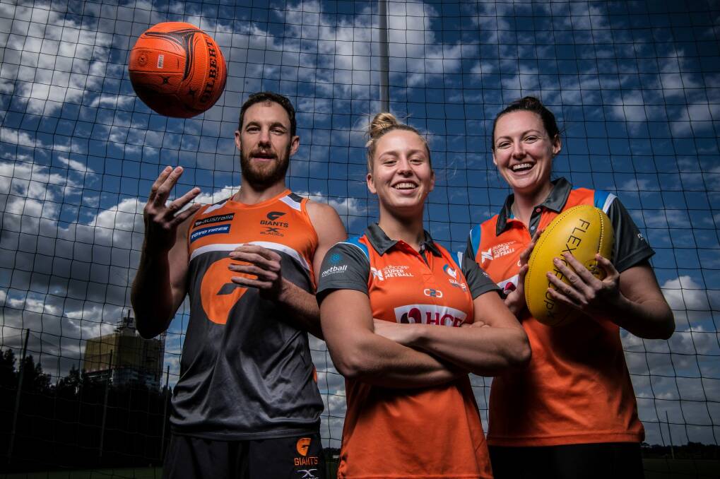 (From left) AFL GWS Giants Shane Mumford with Giants Netball players Jamie-Lee Price and Sam Poolman.  Photo: Wolter Peeters