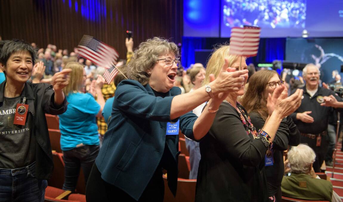 The New Horizons team is applauded after they received signals from the spacecraft that it is healthy. Photo: BILL INGALLS