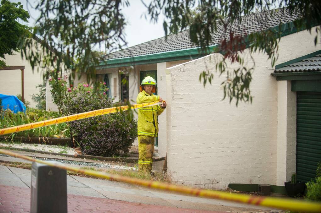 Firefighters at the scene of a house fire in Holt on Saturday. Photo: Dion Georgopoulos