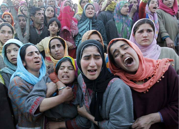 Families scarred by violence ... women mourn at a funeral in Khan Sahib, west of Srinagar, after one person was killed in another militant attack. Photo: Reuters