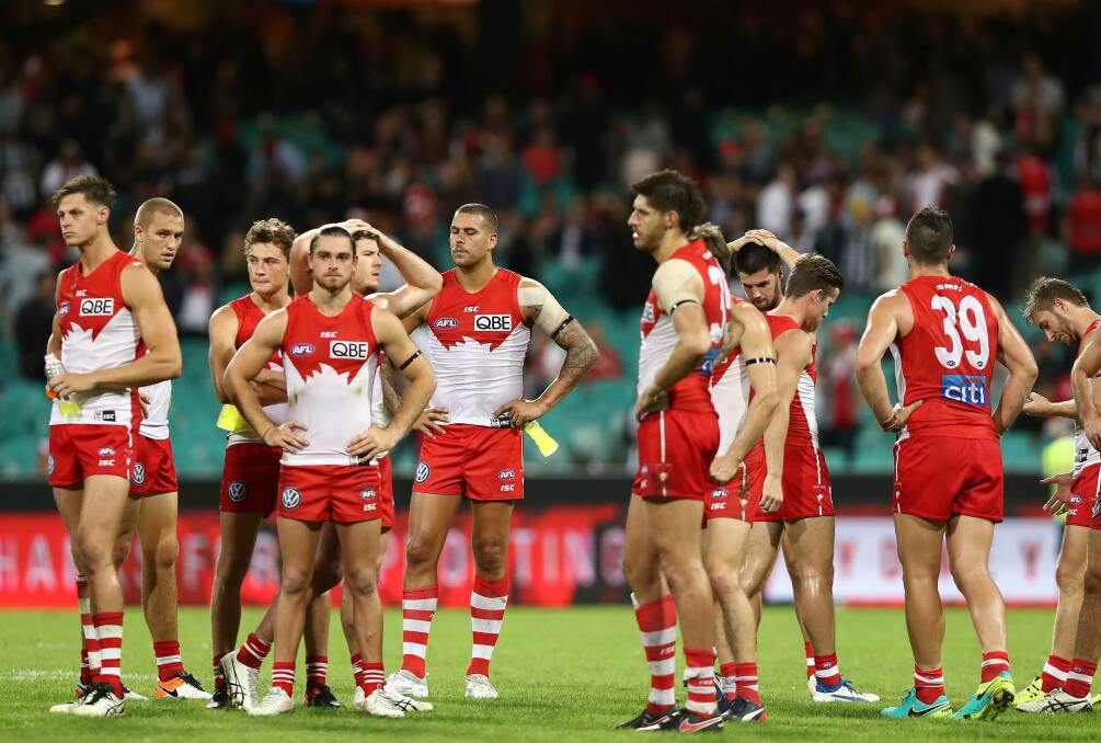 That sinking feeling: The Swans come to terms with a third straight defeat. Photo: Getty Images