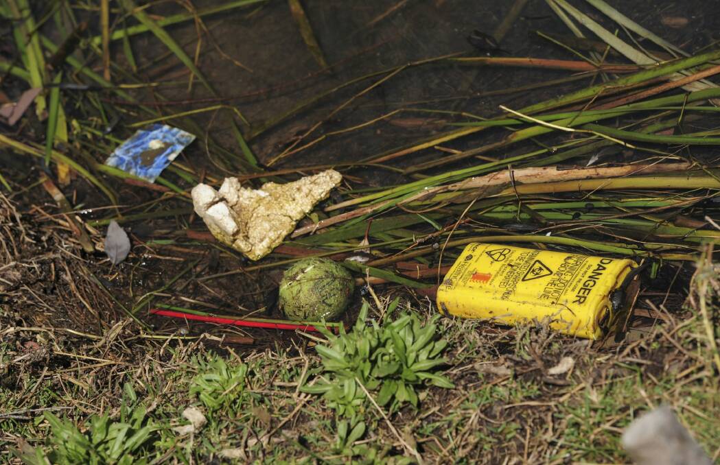Untidy: Rubbish litters the lake shore. Photo: Graham Tidy
