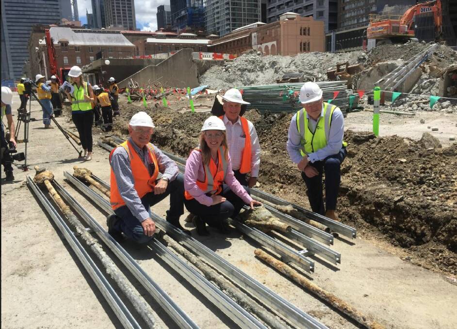 Tourism Industry minister Kate Jones with Destination Brisbane project director Simon Crooks (right) at the unearthing of the 134-year-old electrical cables. Photo: Tony Moore
