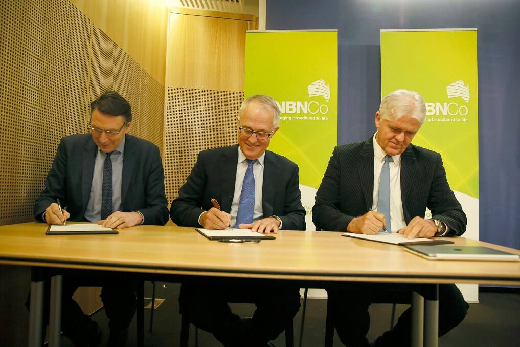 December 2014: then Telstra chief David Thodey (left), Communications Minister Malcolm Turnbull and NBN chief Bill Morrow attend a signing. Photo: Michele Mossop