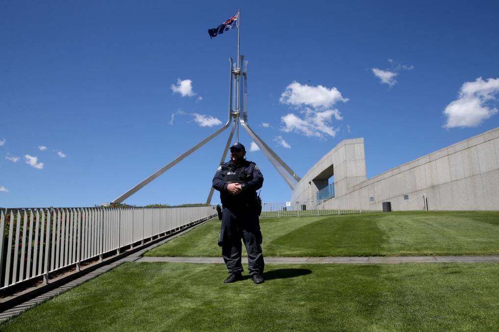 An AFP officer outside Parliament House. Photo: Andrew Meares