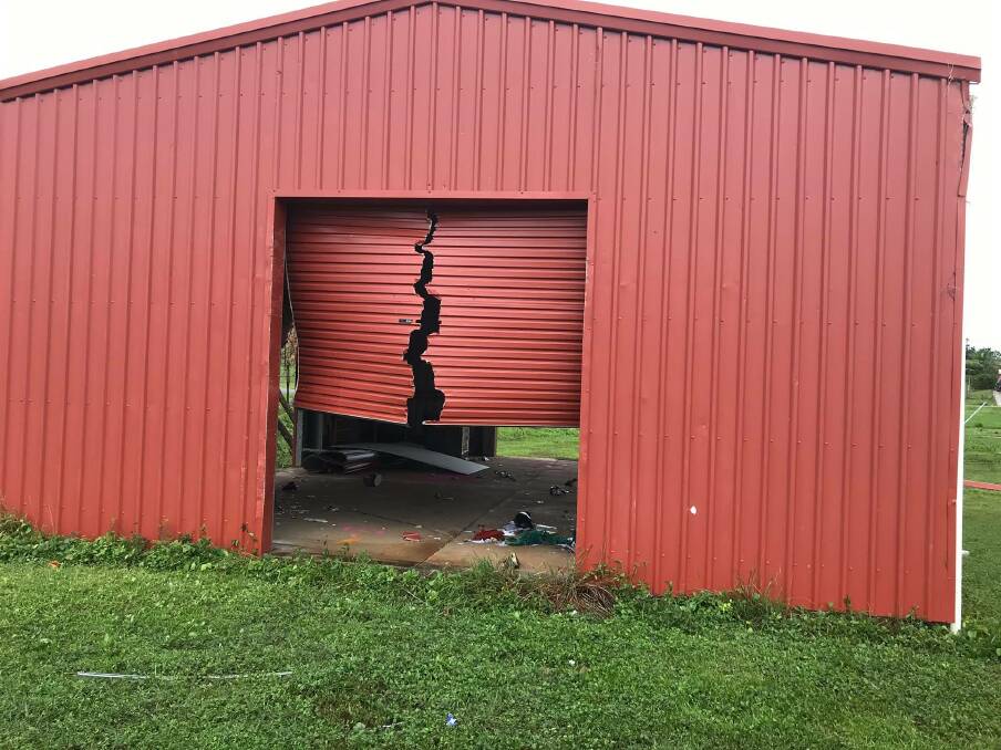 Tropical Cyclone Trevor tore this roller door in Lockhart River. Photo: Facebook - Lockhart River Arts Indigenous Corporation
