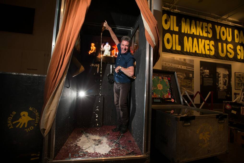 Rob Hirst helped create the exhibition's authentic sticky carpet.  Photo: Jason South