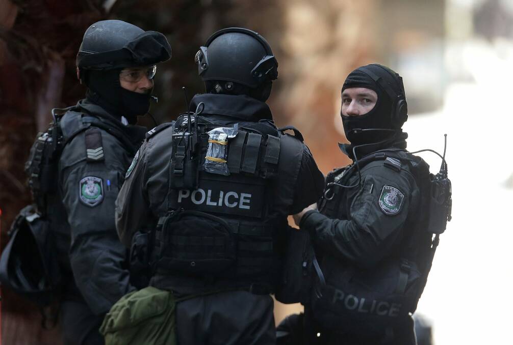 Armed police in Martin Place during the Lindt cafe siege. Photo: Mark Metcalfe