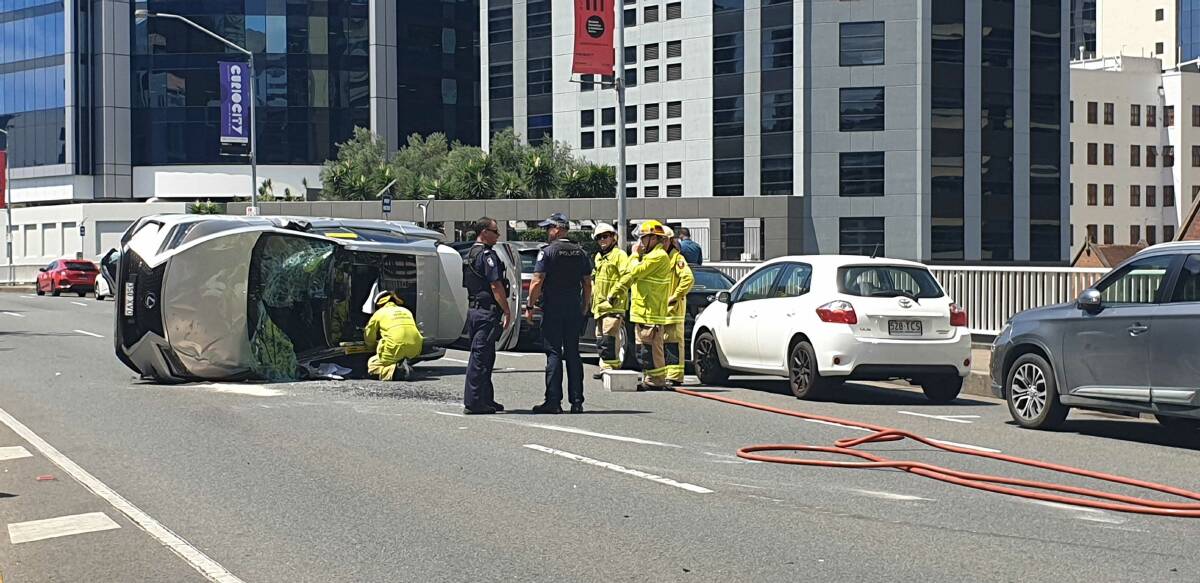 A car rolled on Turbot Street in Brisbane's inner city on Wednesday after it was clipped by another vehicle. Photo: Jocelyn Garcia