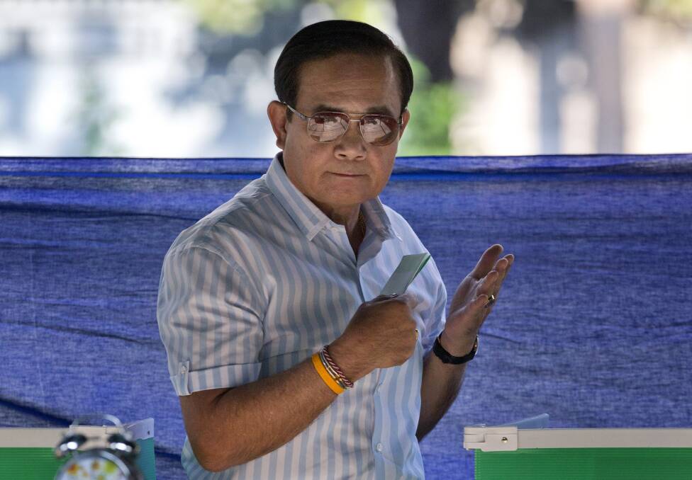 Thailand's Prime Minister Prayuth Chan-ocha casts a vote for himself. Photo: AP