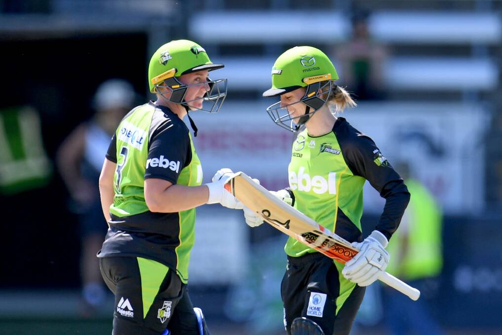 Aggressive: Haynes and Rachel Priest share a smile after another boundary. Photo: AAP