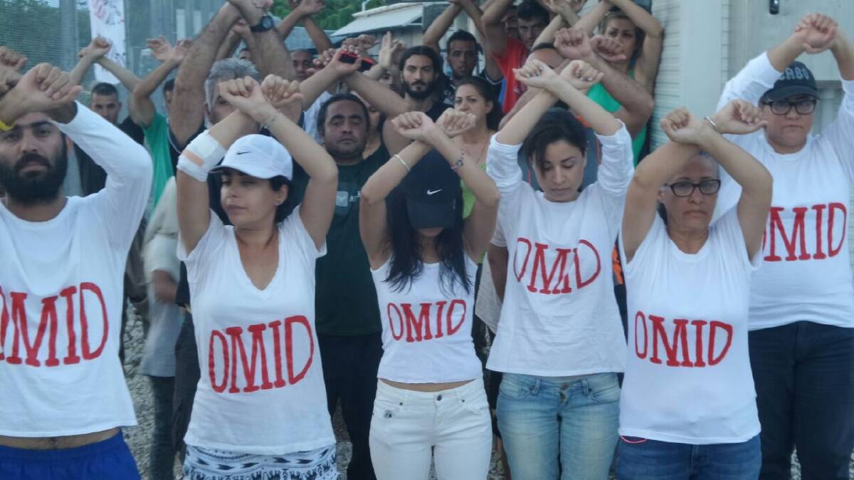 Refugees at Nauru wear t-shirts with Omid Masoumali's name as a show of solidarity. Photo: Supplied