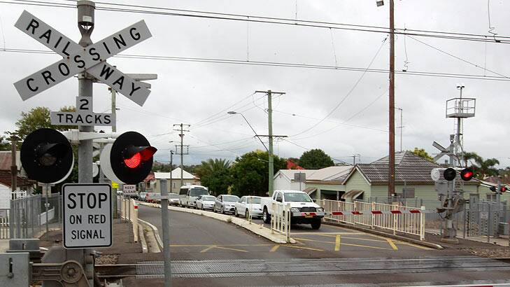 Shared funding to replace rail crossings in Queensland is on the agenda for SEQ City Deal talks. Photo: Peter Stoop