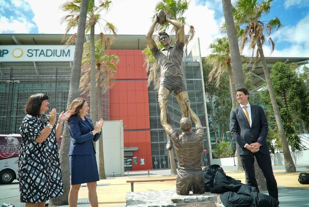 Rugby Australia chief executive Raelene Castle and Premier Annastacia Palaszczuk applaud the career of Wallabies legend John Eales as his statue is unveiled. Photo: Supplied