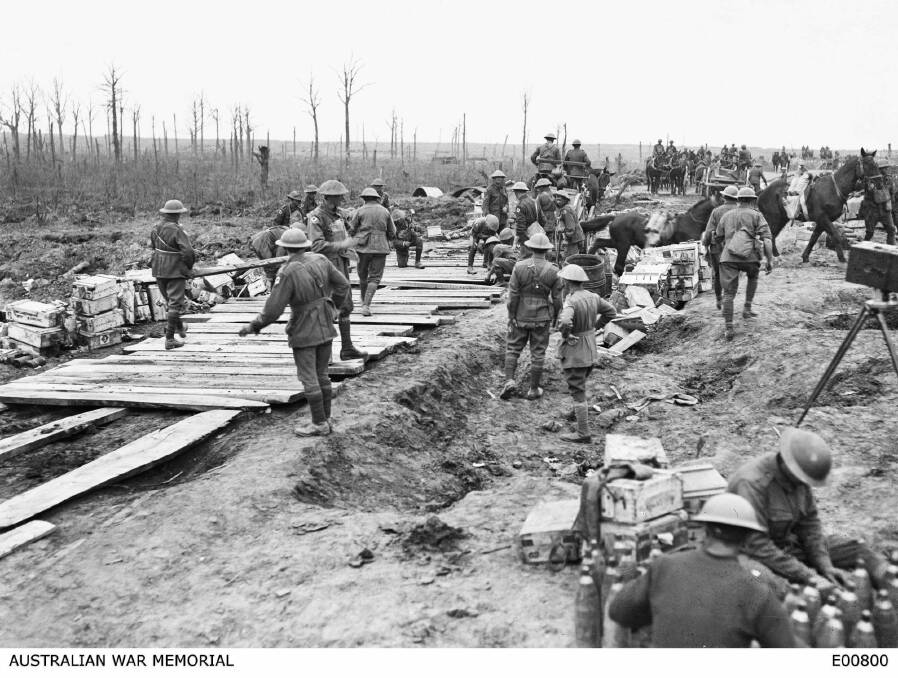 The 2nd Australian Pioneer Battalion making a wagon track from planks of wood at Chateau Wood during the Battle of Passchendaele.  Photo: Australian War Memorial