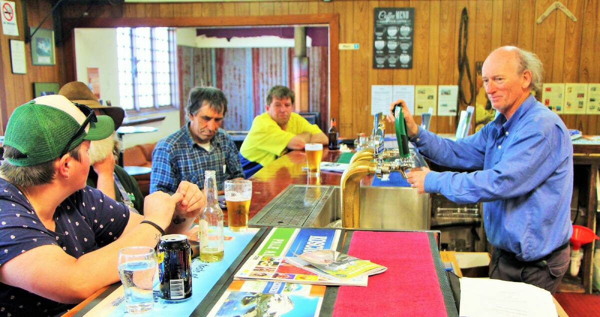 Kelvin Fahey, new owner of the Federal Hotel, serving thirsty locals. Photo: Dave Moore