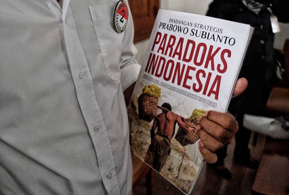 A Prabowo supporter carried his latest book 'Paradox Indonesia'. Photo: James Massola