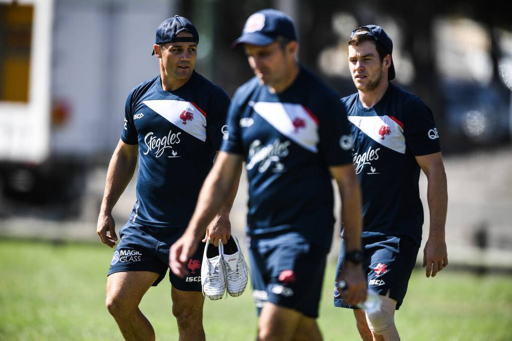 Halkf cooked chooks?: Cooper Cronk (left) and Luke Keary (right) at Roosters training. Photo: AAP