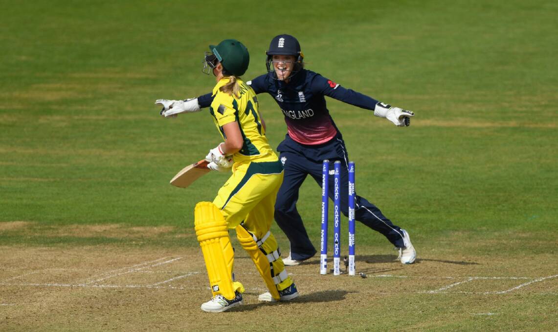 Key wicket: England keeper Sarah Taylor celebrates as Meg Lanning is bowled for 40 runs. Photo: Stu Forster