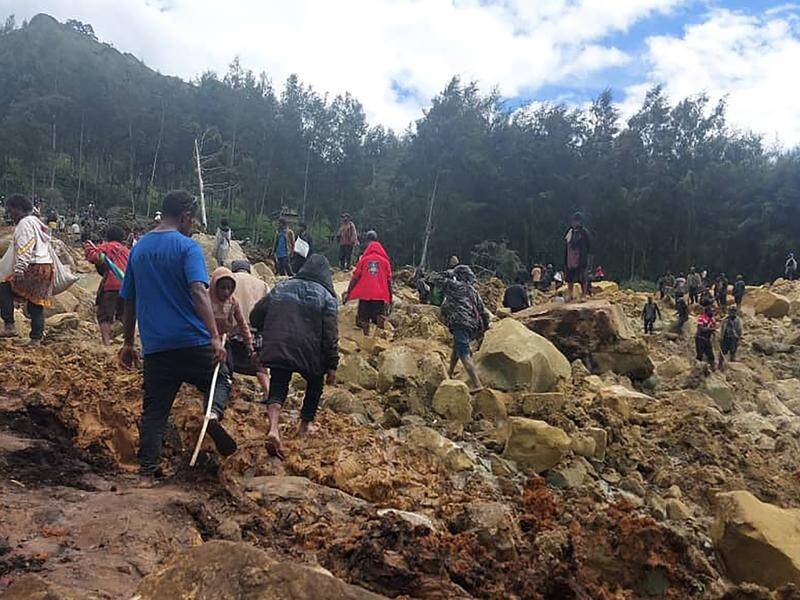 Rescuers are searching for survivors after a landslide hit a village in northern Papua New Guinea. (AP PHOTO)