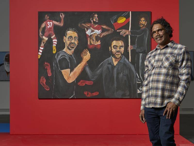 Vincent Namatjira with his work Stand strong for who you are, which won the 2020 Archibald Prize. (HANDOUT/ART GALLERY OF SOUTH AUSTRALIA)
