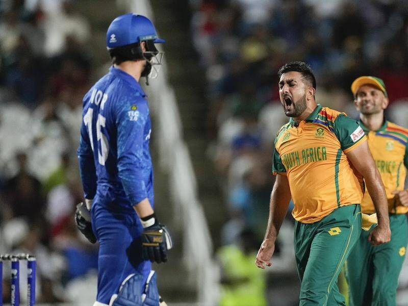 South Africa's Tabraiz Shamsi (right) took three wickets to help skittle Afghanistan. (AP PHOTO)