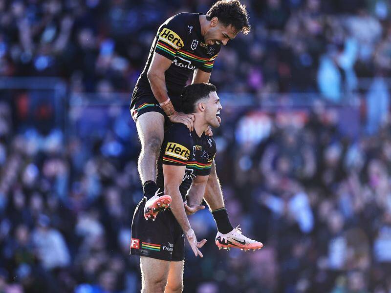 Nathan Cleary (bottom) has kicked a golden point field goal to lift Penrith over the Dolphins. Photo: Mark Evans/AAP PHOTOS